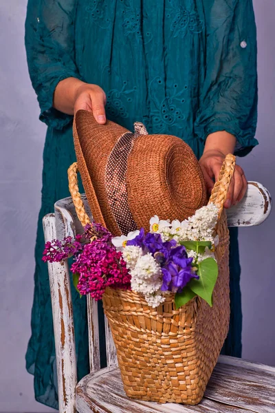 Woman Holding Hands Wicker Bag Lilac Flowers Indoor — Stock Photo, Image