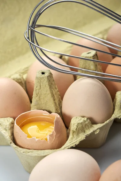 Close-up of eggs in cartoon on white background. Raw chicken eggs in egg box organic food for good health high protein .