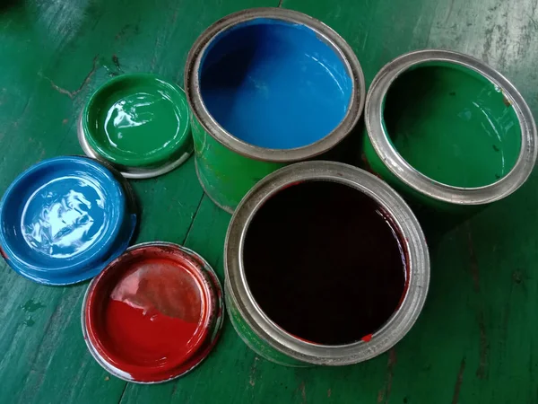 Multiple Paint Pot Green Background — Stock Photo, Image