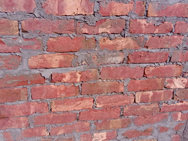 red colored brick wall background closeup