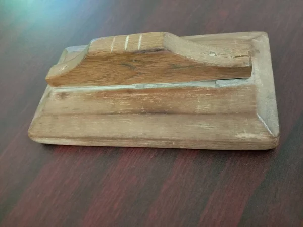 Wooden Plaster Trowel Closeup on Table For Construction