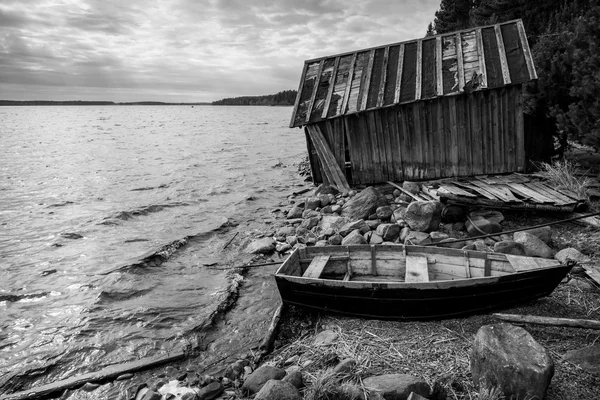 Old wooden fishing boat on lake coast — Stock Image Old wooden fishing boat on lake coast Stock Image