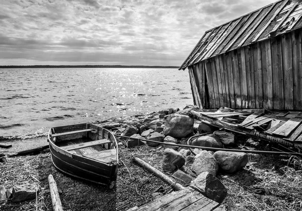 Old wooden fishing boat on lake coast — Stock Image Old wooden fishing boat on lake coast Royalty Free Stock Photos