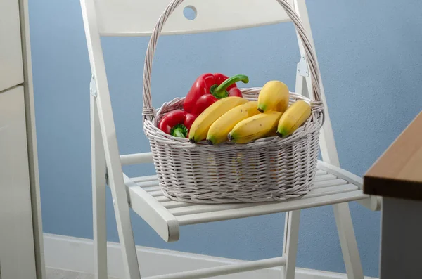 A basket full of vegetables and fruits
