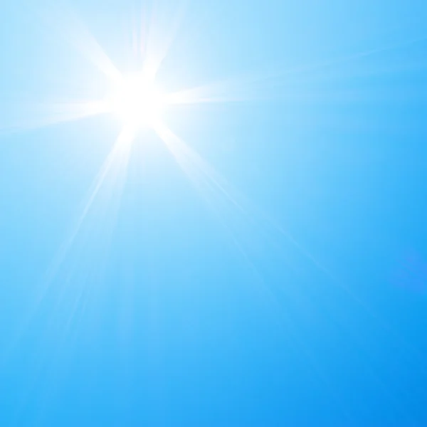 Sun shining in blue sky — Stock Photo, Image