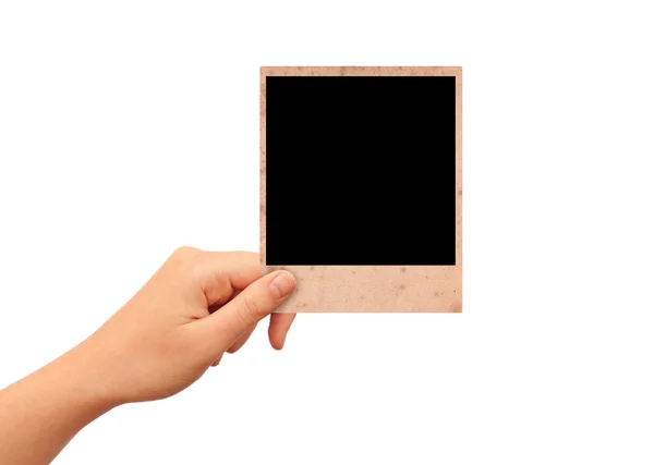 Hand with instant photo card — Stock Photo, Image