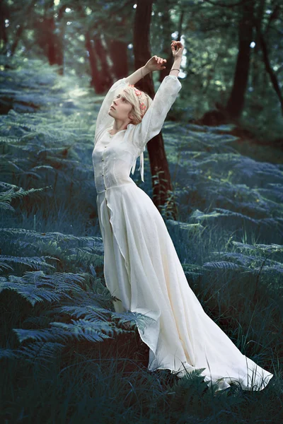 Fairytale woman dancing in forest — Stock Photo, Image