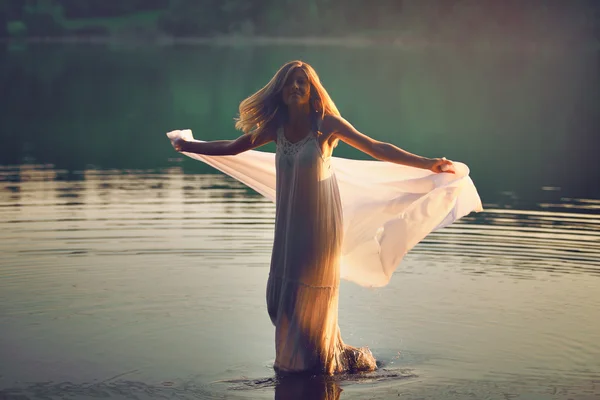 Beautiful woman dancing in the water — Stock Photo, Image