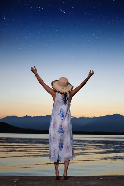 Woman and sky full of stars — Stock Photo, Image