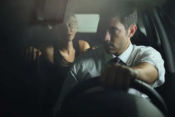 Sensual woman and driver on a car — Stock Photo, Image