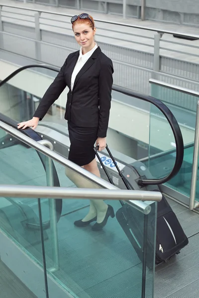Businesswoman with suitcase — Stock Photo, Image