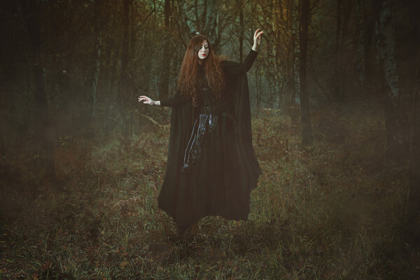Powerful forest witch levitation . Dark fantasy and magic