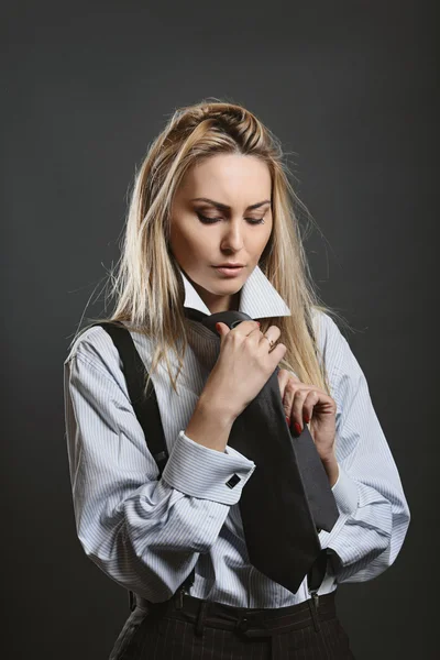 Beautiful woman wearing a black tie — Stock Photo, Image