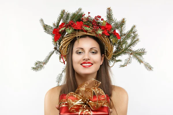 Beautiful christmas woman with gift in hand — Stock Photo, Image
