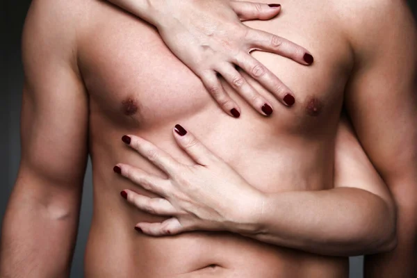 Embracing Couple Female Manicured Hands Hugging Muscular Male Torso Naked — Stock Photo, Image