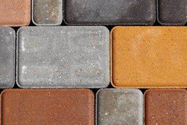 Arkaplan için farklı renkte fayanslar. Taş kaldırım yüzeyi