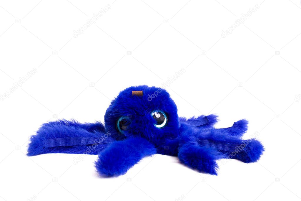 Blue fluffy octopus toy isolated on a white background