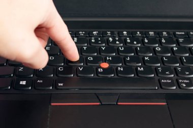 NOVOPOLOTSK, BELARUS - 06 FEBRUARY, 2021: Lenovo laptop keyboard and hand close up