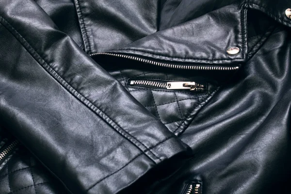 Black leather jacket with zip and stud close up