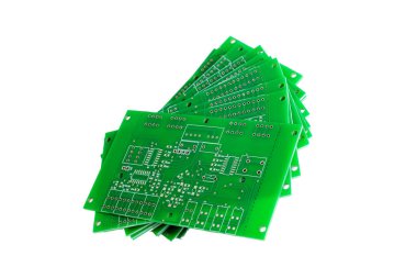 Heap of green printed circuit boards isolated on white background close up clipart