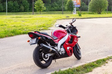 BELARUS, NOVOPOLOSK - 09 JUNE, 2021: Red motorcycle yamaha on the road close up