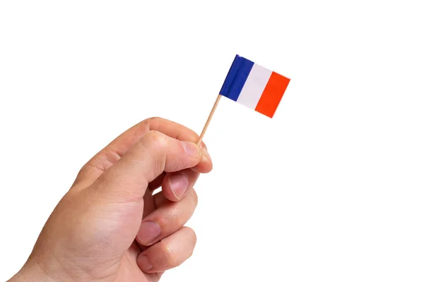 Kleine Franse Vlag Hand Geïsoleerd Witte Achtergrond Close — Stockfoto