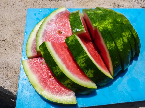 Sliced watermelon on a cutting board — Stock Photo, Image