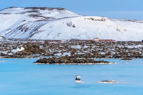 stock image Unique landscape with lava fields and blue thermal water in Iceland. Outside Blue Lagoon in Iceland. The blue water between the lava stones. Hot springs Blue Lagoon in Iceland.