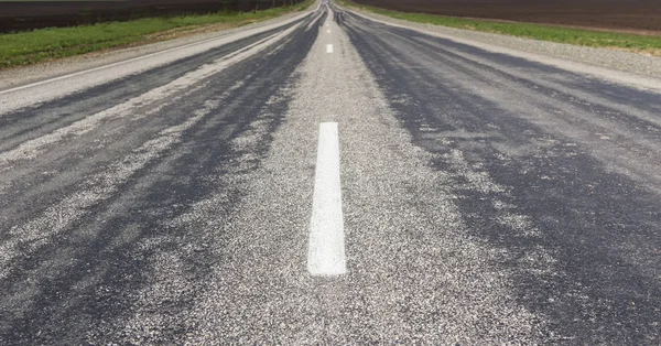 Asfalto pavimentazione in autostrada girare da vicino — Foto Stock