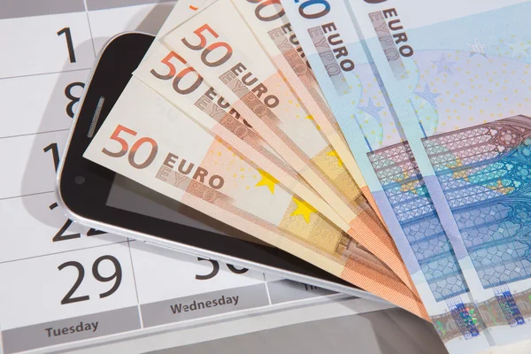 Euro banknotes calendar phone — Stock Photo, Image