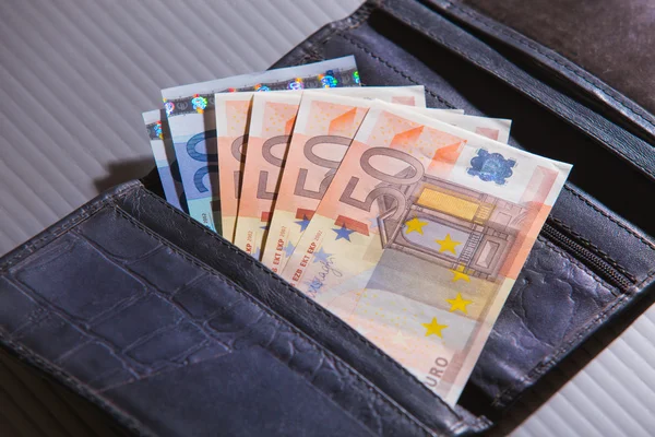 Euro banknotes in leather purse — Stock Photo, Image
