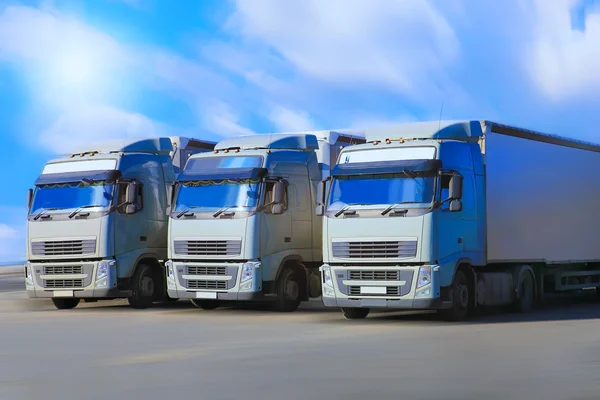 Three trucks go on  highway — Stock Photo, Image