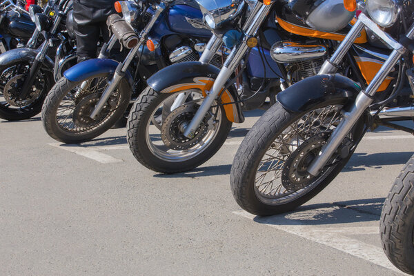  motorcycles on parking on asphalt