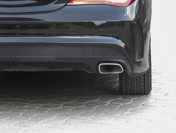 Exhaust pipe and back part of car — Stock Photo, Image