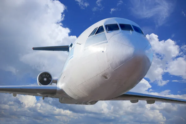 Passenger plane in the blue sky — Stock Photo, Image