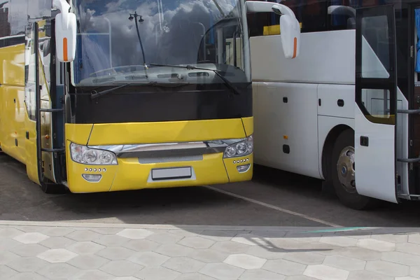 Tourist buses in the parking lot at the bus station close-up