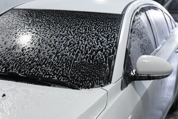 Car covered with foam — Stock Photo, Image