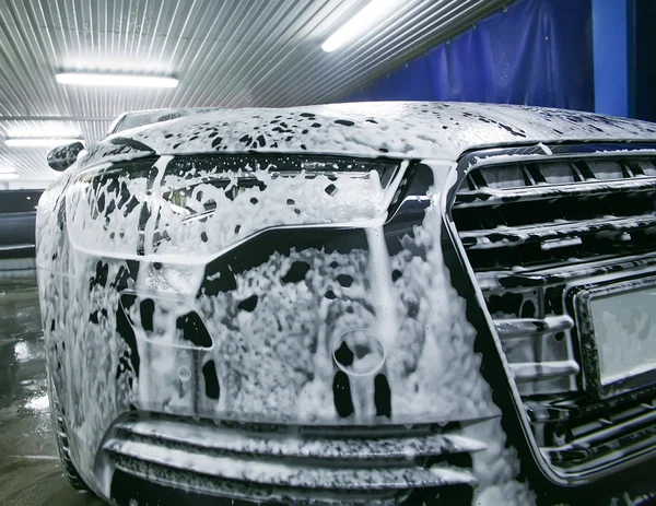 Car in foam on sin — Stock Photo, Image