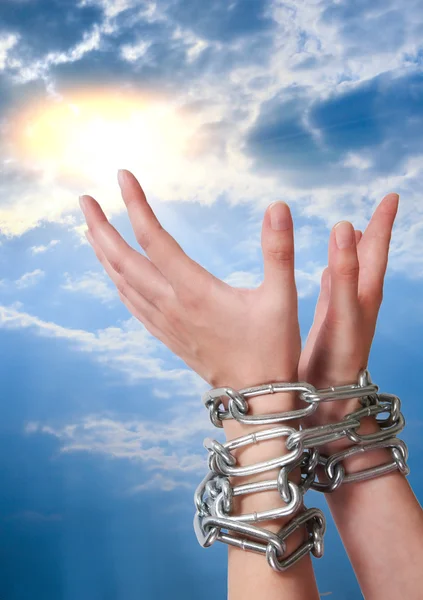 Female hands tied by chain — Stock Photo, Image