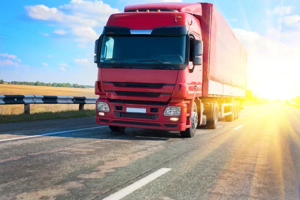 Red truck on country highway — Stock Photo, Image