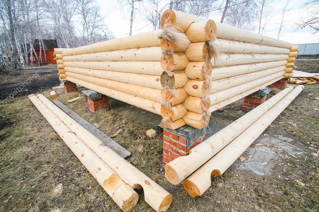 house under construction from pine logs