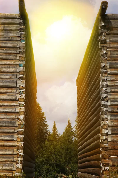 Sun in cloudy sky over houses — Stock Photo, Image