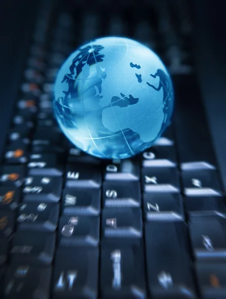 Globe on the computer keyboard Royalty Free Stock Photos