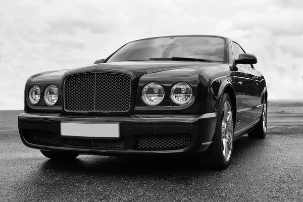 Prestigious car on road monochrome — Stock Photo, Image