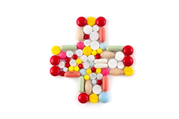 Cross from different pill — Stock Photo, Image