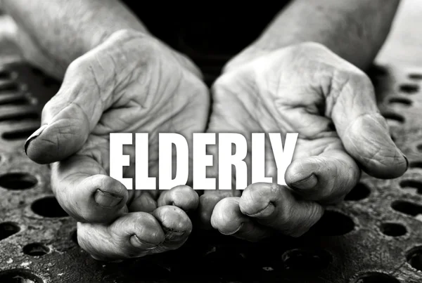 Elderly in the old female hands — Stock Photo, Image