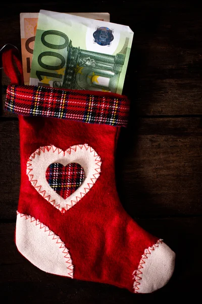 Geld in der Weihnachtssocke — Stockfoto