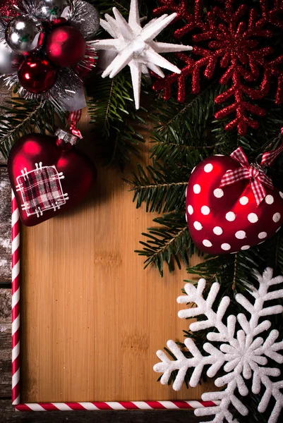 Board in the middle of Christmas decoration — Stock Photo, Image