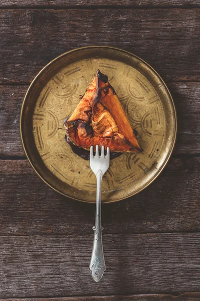 Grilled pumpkin slice in the old plate