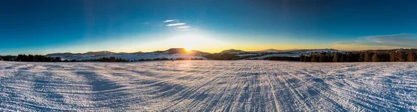 Sunset over the mountin in winter time — Stock Photo, Image